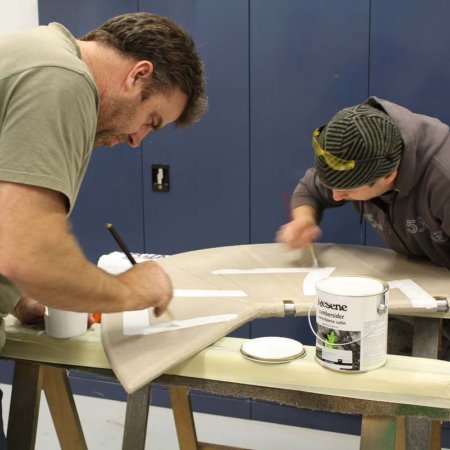 Olly And Paul Painting Iron Cross On Rudder