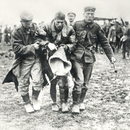 017 German Troops Helping Wounded British Pilot
